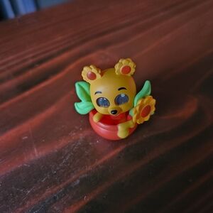 Disney Yellow and Green Action Figure